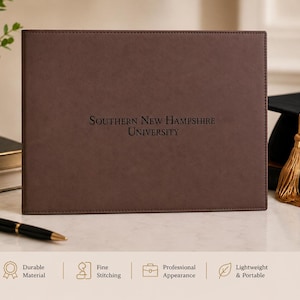 May include: A rectangular brown diploma cover featuring the text Southern New Hampshire University embossed in the center. The cover has visible stitching along the edges and a smooth, matte finish, designed to hold and protect academic documents.