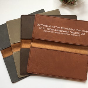 May include: Four rectangular checkbook covers in shades of gray, tan, dark brown, and light brown. The light brown cover features the text: DO YOU WANT TEXT ON THE INSIDE OF YOUR COVER SELECT FRONT & INNER WHEN CHECKING OUT (TOP PORTION WILL BE ENGRAVED IF PURCHASED).
