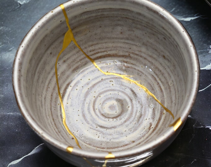 White chawan repaired with pure gold kintsugi foodsafe and unique