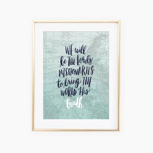 May include: A framed print with a vintage map background and the text "WE will be THE Lord's MISSIONARIES to bring THE WORLD His truth" in navy blue lettering.
