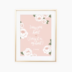May include: A pink printable art print with a floral design and the quote "I carry your heart. (I carry it in my heart) - E.E. Cummings".