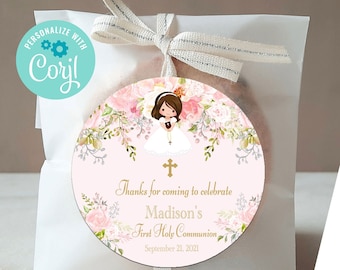 May include: A pink and white round favor tag with a floral design and a girl in a white dress. The tag says "Thanks for coming to celebrate Madison's First Holy Communion September 21, 2021".