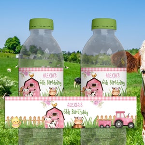 May include: Printable water bottle labels featuring a pink and green farm theme with a barn, cows, chicks, and a tractor. The labels say "Alexia's 6th Birthday".