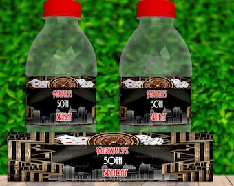 May include: Water bottle labels with a black and gold casino theme. The labels feature a roulette wheel, playing cards, and the text "Caravell's 50th Birthday". The labels are 8 inches by 2 inches and can be printed multiple times on one sheet of paper.