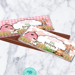 May include: Two printable chocolate bar wrappers featuring a pink and white gingham pattern with a farm scene. The wrappers say "Alexia's 6th Birthday".