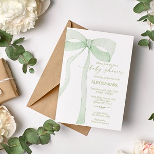 May include: A green watercolor bow with a white background. The text reads "Please join us for a baby shower honoring the parents to be Alexis & Mark Saturday, April 24th, 2021 2:00pm - 6:00pm North Ridge Country Club 123 Main Street Raleigh, NC 27601 RSVP by April 1, 2021 to [phone number]  Registrations at Target and Amazon"