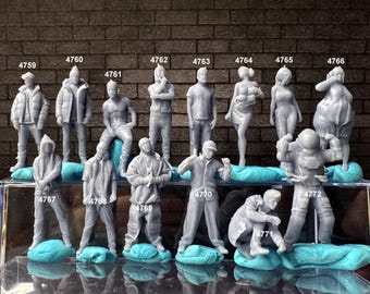 May include: A collection of 14 gray 3D printed figurines, each with a unique pose and design. The figurines are arranged in two rows on a blue and white surface. The figurines are numbered 4759 through 4772.