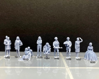 May include: A set of 10 miniature figures in various poses, including a couple, a woman in a dress, a woman with a hat, a man with a gun, and a woman sitting down. The figures are all made of a light gray plastic.