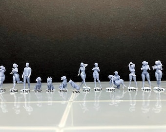 May include: A set of 12 miniature figures, including people and animals, in a light blue color. The figures are arranged in a row on a white surface. The figures are numbered 1759 through 1771.