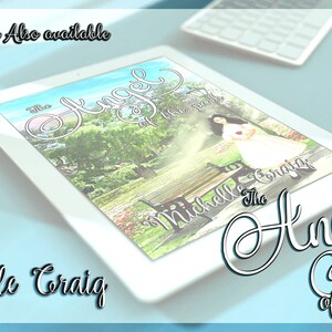 May include: A white tablet computer displaying the cover of a book titled "The Angel of the Park" by Michelle Craig. The cover features a woman in a white dress standing in a park with a bench and trees in the background.