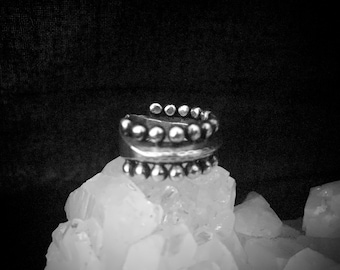 Industrial sterling silver ring with round studs all around