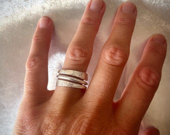 Wrapped silver wire turning into two flat hammered wings, sterling silver wraparound thin ring