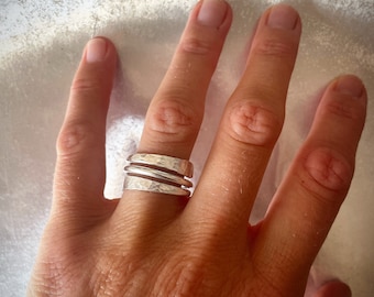 Wrapped silver wire turning into two flat hammered wings, sterling silver wraparound thin ring