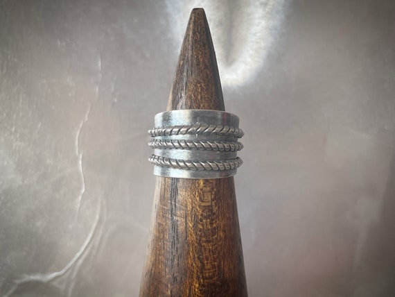 Rope wrapped on dark base silver ring