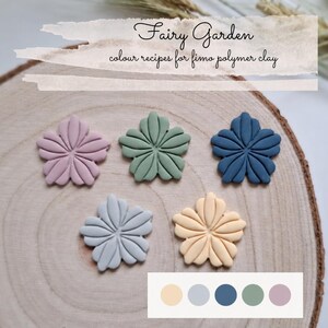 May include: Five flower-shaped polymer clay pieces in pastel pink, sage green, dark blue, light gray, and pale yellow. The text "Fairy Garden colour recipes for fimo polymer clay" is visible at the top, with a color palette chart at the bottom.