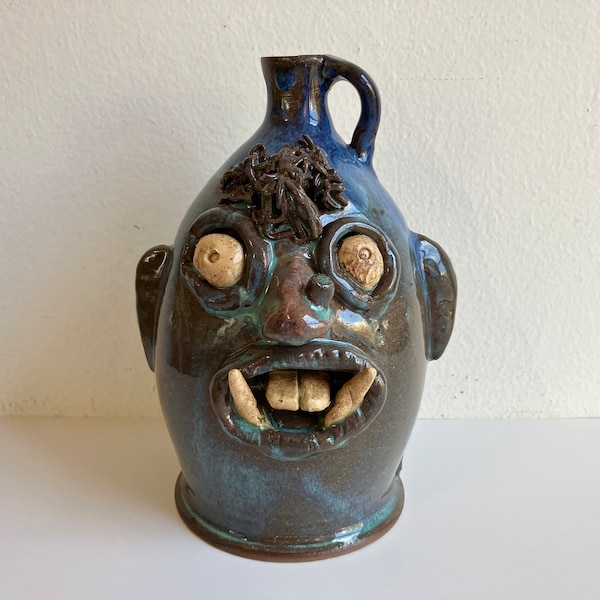 Vintage Ugly face pottery jug, folk art, medallion signed, 8.5" tall, heavy, blue and brown and turquoise, Southern folk art