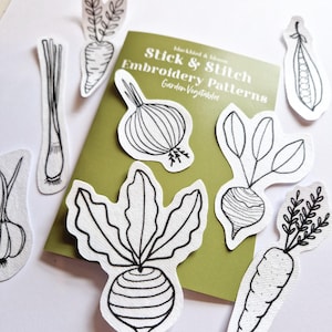 May include: Black and white line drawings of various vegetables, including a carrot, onion, pea pod, turnip, and leek. The drawings are on white paper and are labelled "Stick & Stitch Embroidery Patterns - Garden Vegetables".