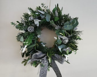 Fresh Christmas Wreath with a silver - moss based