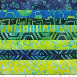 May include: A fabric strip quilt with alternating stripes of blue, green, and yellow. The fabric has different patterns, including circles, geometric shapes, and abstract designs.