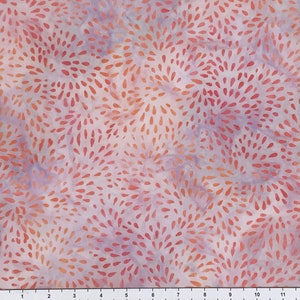 May include: A white fabric with a repeating pattern of small, orange and red teardrop shapes arranged in a radiating pattern.