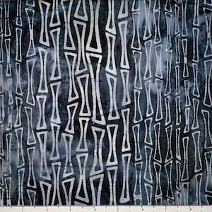 May include: A dark blue fabric with a white geometric pattern of repeating shapes. The pattern resembles a series of vertical lines with a slight wavy effect.