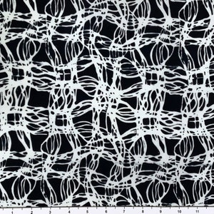 May include: Black and white fabric with a repeating pattern of intricate, organic shapes. The design resembles a network of interconnected lines and curves.