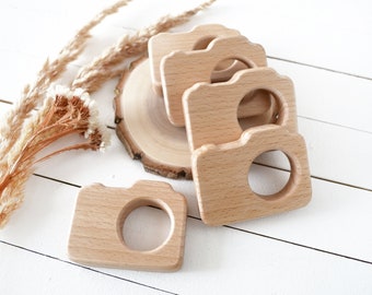 Bulk wooden camera teether toy with logo . Personalized newborn photographer client gift