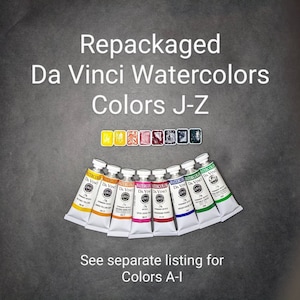 May include: A collection of Da Vinci watercolors in tubes and pans, labeled "Colors J-Z." The image displays a variety of vibrant colors, including yellow, orange, pink, red, blue, and green. Text on the image reads "Repackaged Da Vinci Watercolors" and "See separate listing for Colors A-I."