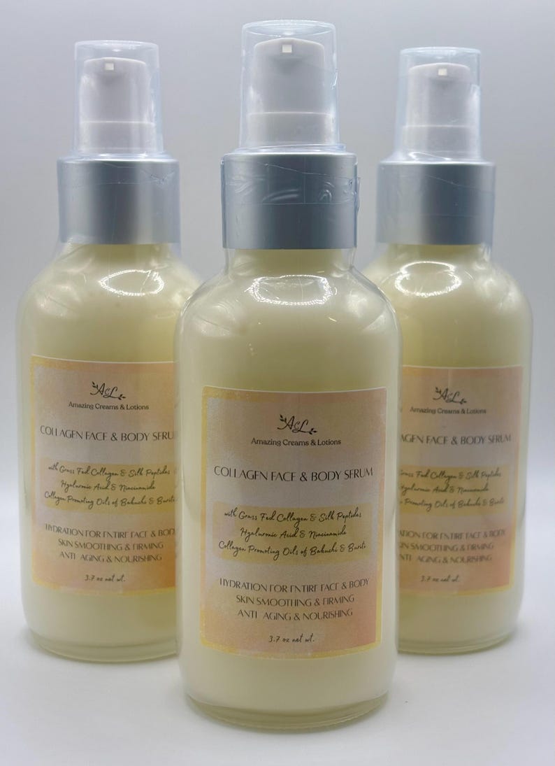 May include: Three glass bottles of Collagen Face & Body Serum with silver pump tops. Each bottle has a cream-colored liquid and a label with text. The labels include the brand name, product name, and ingredients. Each bottle contains 3.7 fl oz.