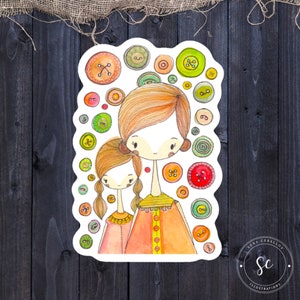 May include: A watercolor illustration of two people, a mother and daughter, with colorful buttons surrounding them. The mother is wearing a long orange dress with yellow accents and the daughter is wearing a pink dress with a gold necklace. The illustration is surrounded by a white border.