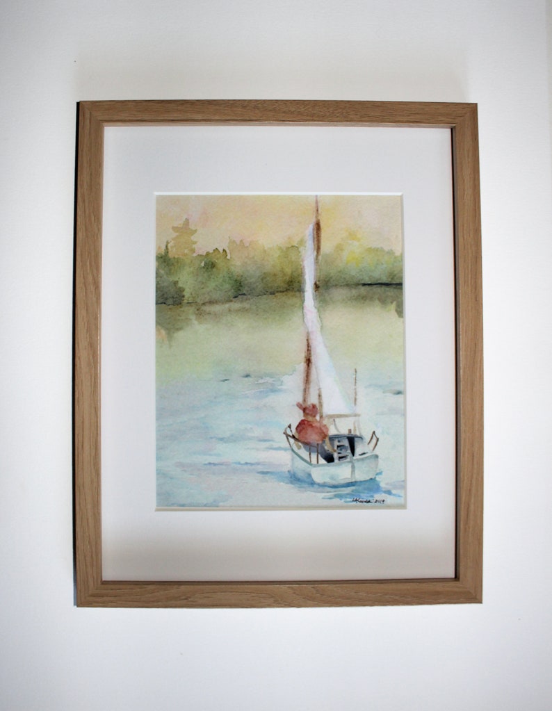 May include: A watercolor painting of a sailboat on a lake with a forest in the background. The sailboat has a white sail and a red figure in the boat. The water is a light blue and the sky is a light yellow.