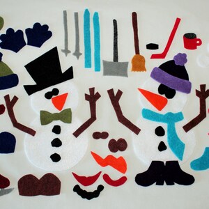 May include: Felt craft pieces for making two snowmen. The pieces include white snowmen bodies, brown arms, black hats, orange noses, black eyes, black buttons, green and blue scarves, red mittens, brown boots, and a variety of other accessories.