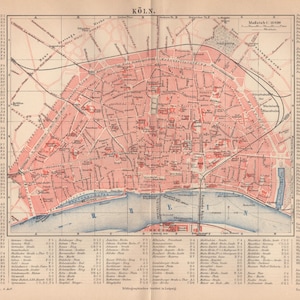 May include: A vintage map of Cologne, Germany, in shades of red, pink, and blue. The map details the city's layout, including streets, buildings, and the Rhine River. Text in German is visible, with the title "Köln" at the top.