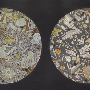 May include: Two circular images of geological samples. Each sample displays a variety of mineral grains in shades of gray, yellow, and white, set against a dark background. The grains have irregular shapes and sizes, creating a textured appearance.
