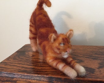 Needle felted stretching ginger cat