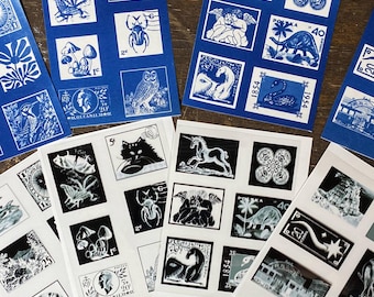 May include: A collection of eight rectangular sheets featuring grid layouts of postage stamp designs. Four sheets are printed in blue ink on white paper, and four are printed in black ink on white paper. Each sheet displays various illustrations.