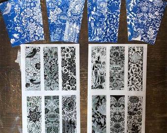 May include: A collection of rectangular bookmarks featuring intricate botanical and floral patterns. The top row displays designs in shades of blue and white, while the bottom row consists of two sheets containing six bookmarks each in black, white, and gray tones.