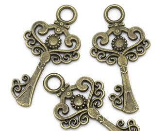 4 pendentifs breloques clefs 33X17mm bronze