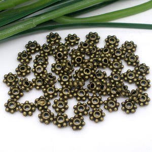 50 flower beads 4x4mm bronze interlayers
