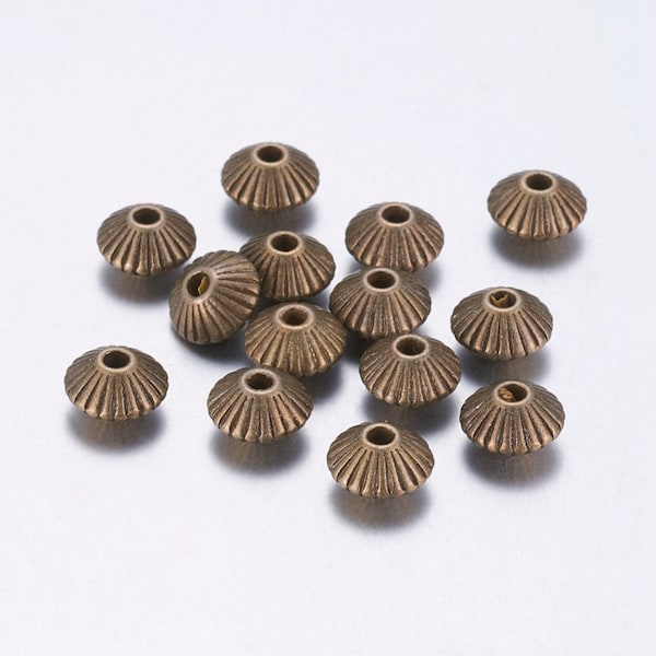 10 perles intercalaires 7,5 x 4,5 mm soucoupes rayées couleur bronze