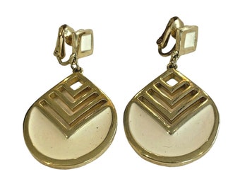Vintage Crown Trifari clip on earrings, Gold tone drop & dangle earrings with creamy white enamel finish, 1980's Boss Lady fashion jewelry