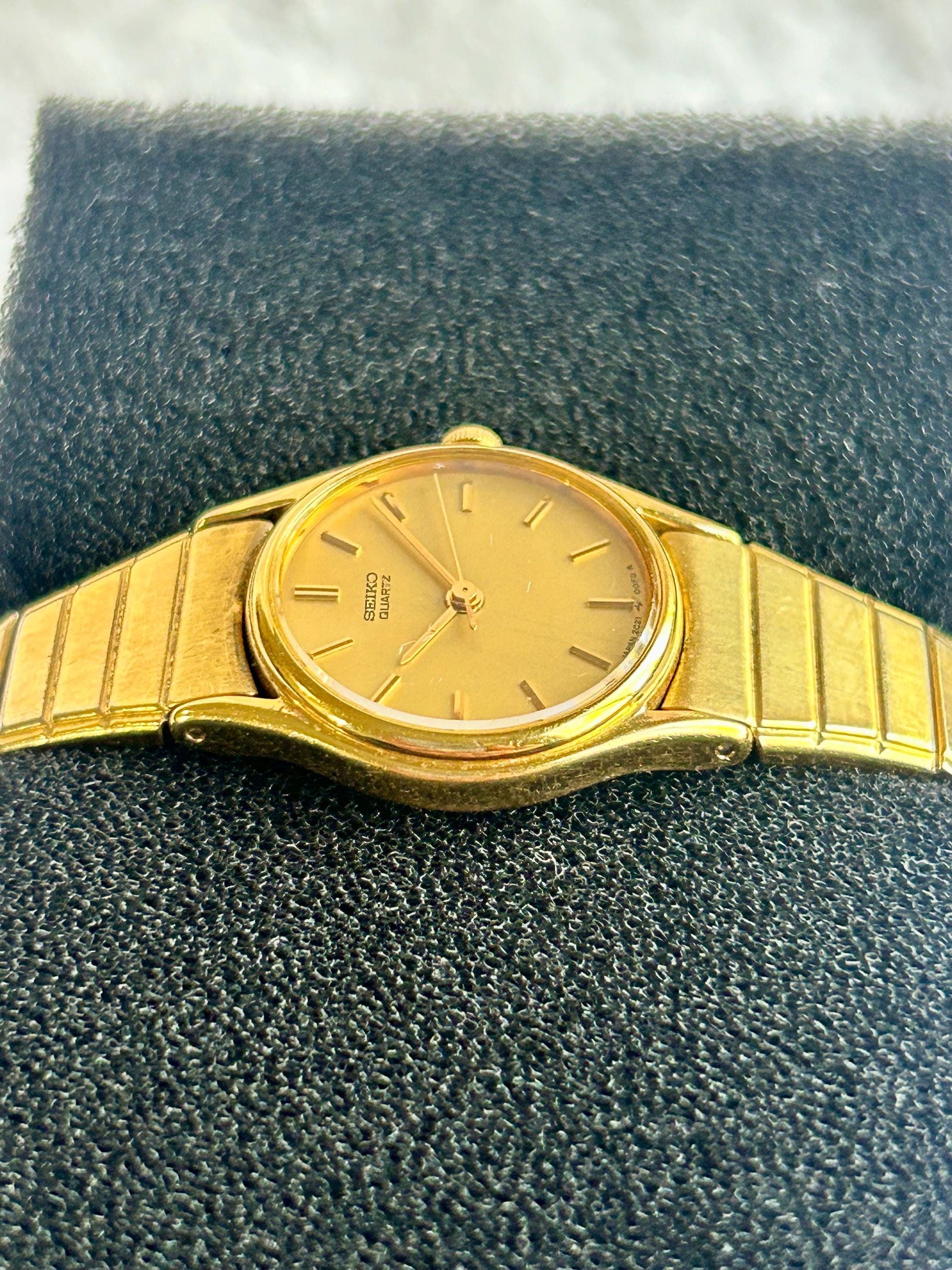 Seiko Quartz Gold Tone Vintage Watch Japan Textured Band Women Cocktail 1990 Seiko Half Moon Gold Women Watch 1N00-5E00 She carries  main image 4