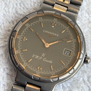 Vintage 33mm Longines Conquest V.H.P. Titanium Quartz Calendar