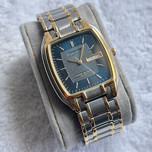 Modern Armitron Day/Date Two-Tone Gold Plated Stainless Steel Quartz Watch