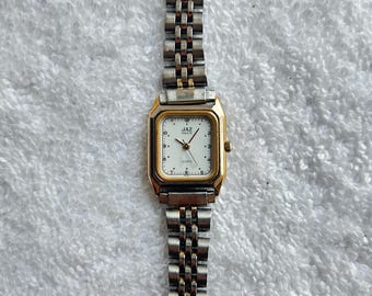 Reloj vintage Jaz Paris Francia de cuarzo en dos tonos, chapado en oro y acero inoxidable, fabricado en Francia.