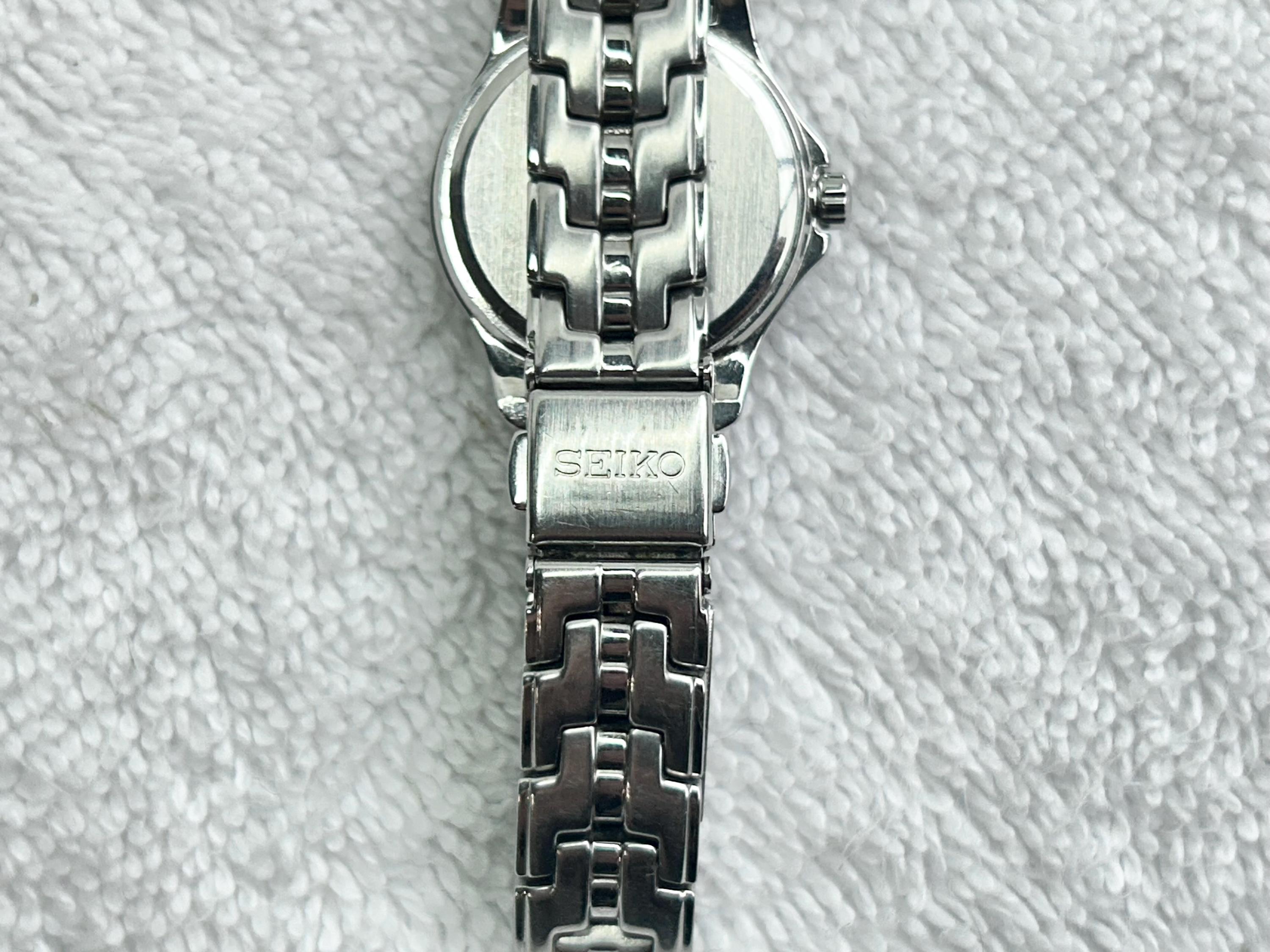 Seiko lady battery water resistant 100m stainless steel w/date Amazon.com: Seiko Women main image 3