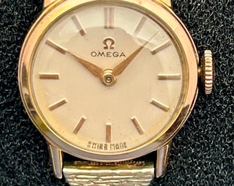 Reloj Omega de cuerda manual para mujer, chapado en oro y de acero inoxidable, de la década de 1950. Totalmente revisado.