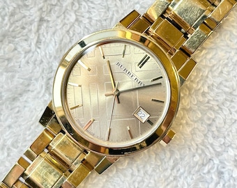 Reloj Burberry de cuarzo chapado en oro para mujer, fabricado en Suiza, con  ajuste rápido de fecha
