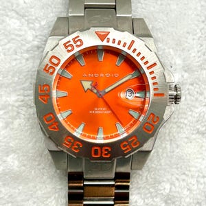 Rare trouvaille Android Silver Jet Diver, 500 mètres 1650 pieds, réglage rapide de la date, lunette tournante, quartz, fabrication suisse.