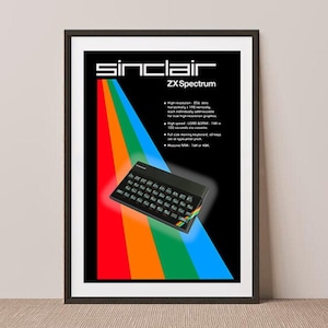 May include: A vintage Sinclair ZX Spectrum home computer poster with a rainbow background. The poster features a black and white image of the computer with the text "Sinclair ZX Spectrum" in white.